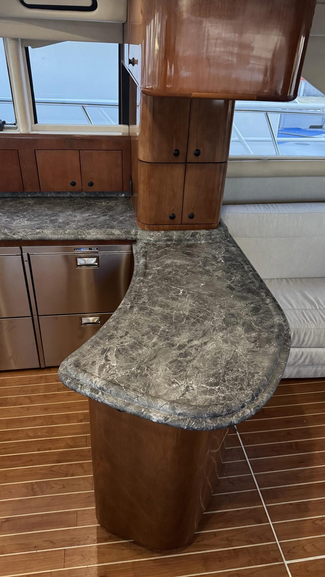 Grey marble-look 3M DI-NOC galley countertop installed on a yacht at Miami Marina