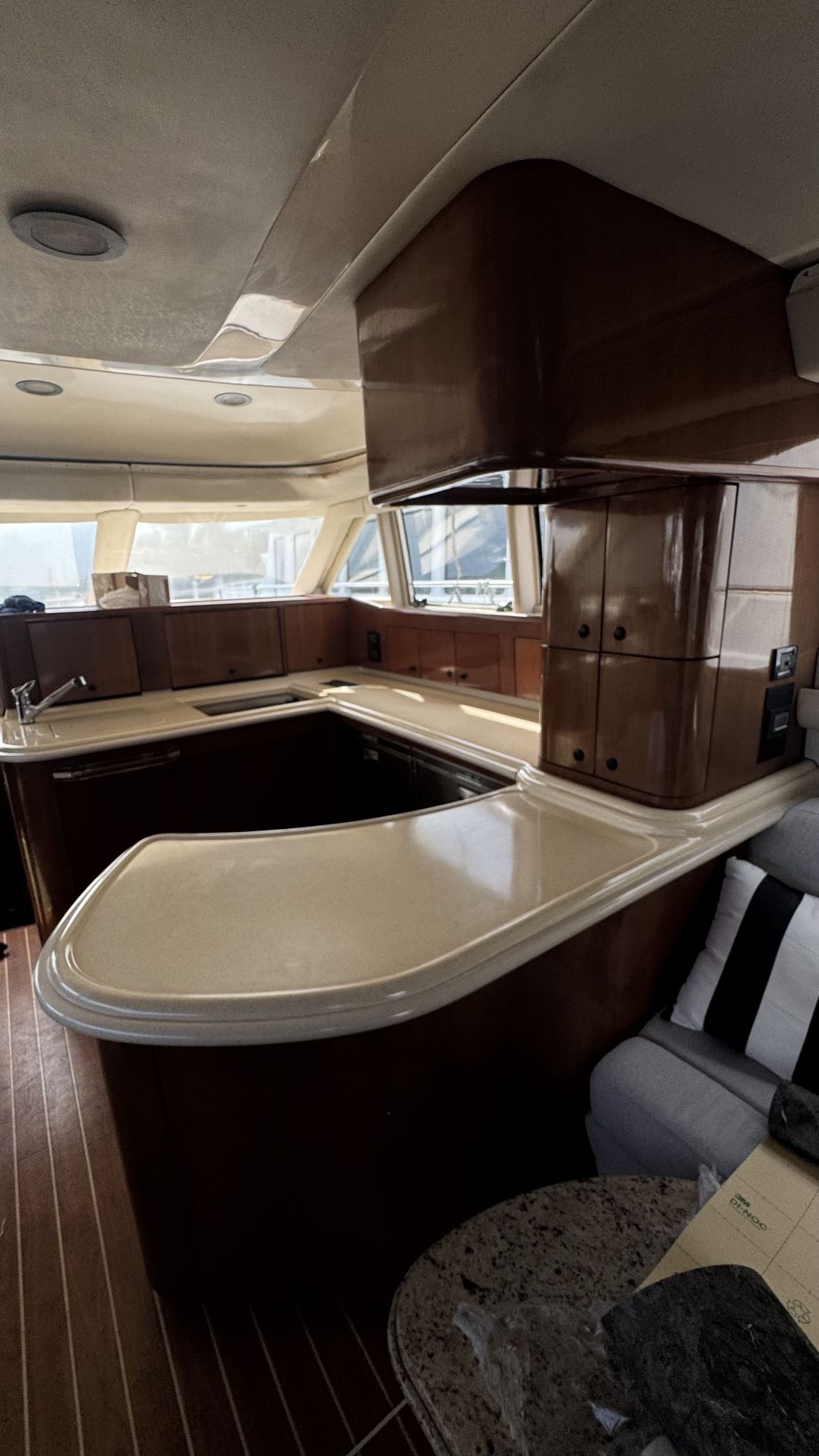 Yacht galley countertop before renovation, worn beige laminate